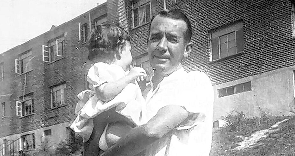 Frederick “Fred” Leonard Coste holds his daughter, Dianne, in 1953. Coste was fatally stabbed Oct. 15, 1959, at Family Finance Corporation in Cedar Rapids.